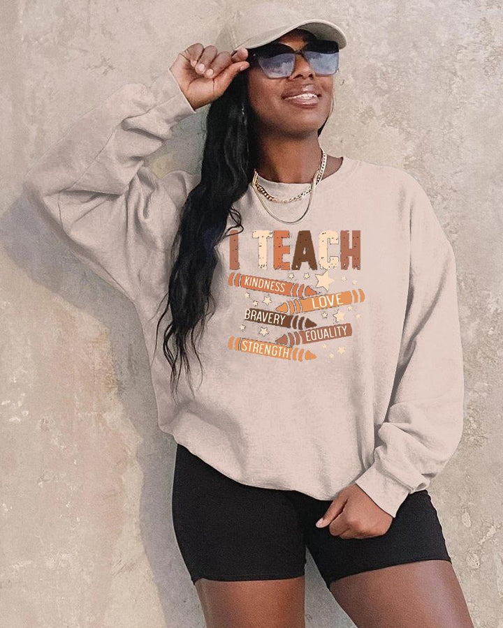 I Teach Melanin Long Sleeve Crewneck Sweatshirt