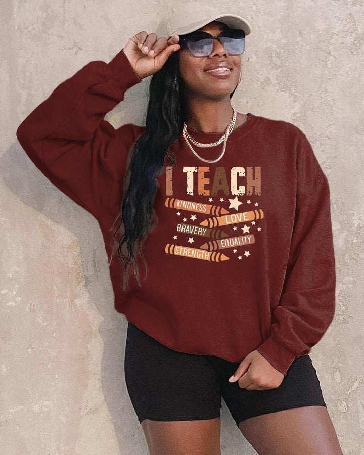 I Teach Melanin Long Sleeve Crewneck Sweatshirt